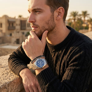 Elegant man wearing Hugo Boss Ikon 1512963 men's quartz battery watch with silver case and luxury racing blue dial