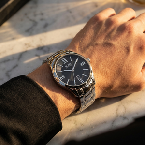 Close up of Hugo Boss Ambassador 1513025 on wrist showing black dial and silver metal strap with 30m water resistance