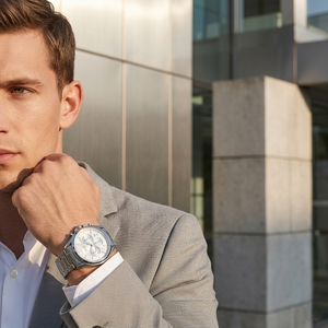 Professional man wearing Hugo Boss Driver 1513039 with silver dial and silver metal link strap water resistant 30m