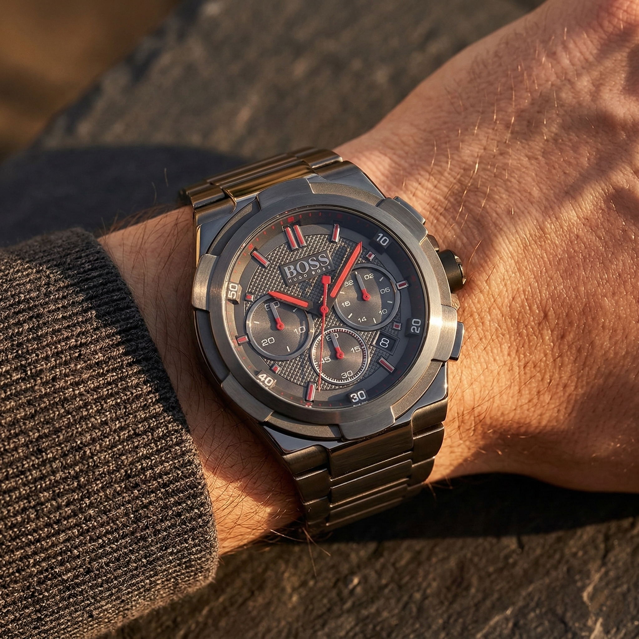 Close up of Hugo Boss Supernova 1513361 on wrist showing gray textured dial and red markers with gray metal strap 50m water resistance