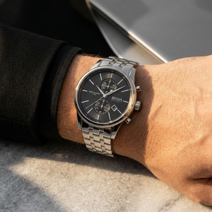 Close up of Hugo Boss Jet 1513383 on wrist showing black dial and silver metal strap with 50m water resistance