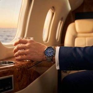 Lifestyle photo of Boss Rafale 1513510 showing the bold silver watch on a man's wrist in a professional setting from Luxury Hub Store