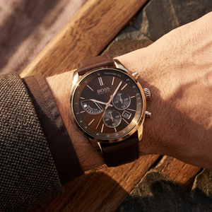 Close up of Hugo Boss Grand Prix 1513605 on wrist showing brown dial and brown leather strap with 30m water resistance