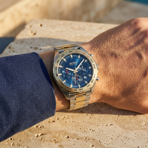 Close up of Hugo Boss Intensity 1513667 on wrist showing blue dial and two-tone metal strap with 50m water resistance