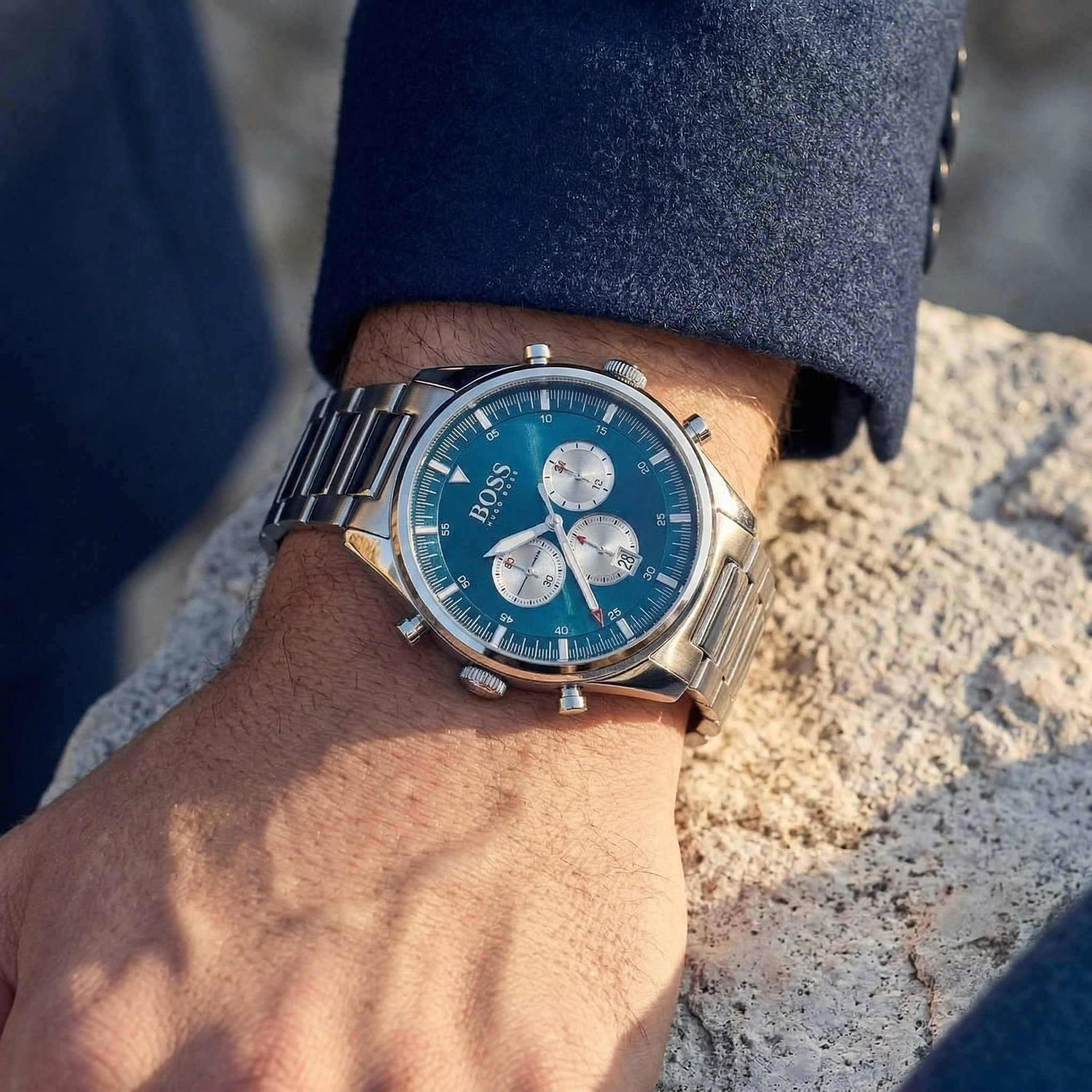 Close up of Hugo Boss Pioneer 1513713 on wrist showing blue dial and silver metal link strap with 50m water resistance