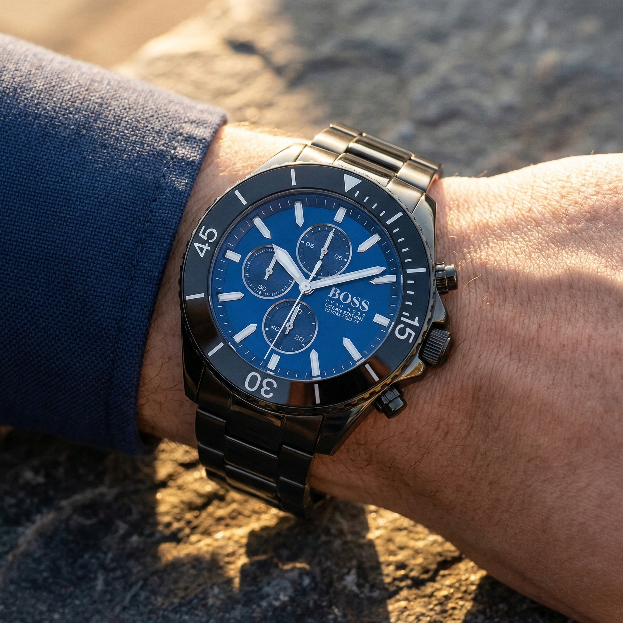 Close up of Hugo Boss Ocean Edition 1513743 on wrist showing blue dial and black metal strap with 100m water resistance