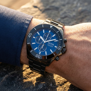 Close up of Hugo Boss Ocean Edition 1513743 on wrist showing blue dial and black metal strap with 100m water resistance