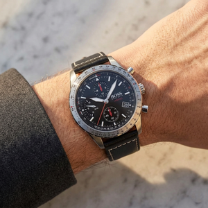 Close up of Hugo Boss Aero 1513770 on wrist showing black dial and black leather strap with 50m water resistance