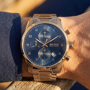 Close up of Hugo Boss Skymaster 1513788 on wrist showing blue dial and brown metal strap with 50m water resistance