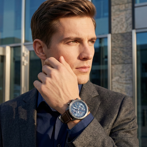 Professional man wearing Hugo Boss Pilot Edition 1513852 with blue dial and brown leather strap water resistant 50m