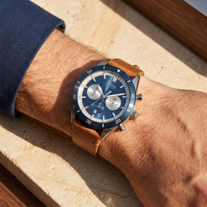 Close up of Hugo Boss Santiago 1513860 on wrist showing blue dial and brown leather strap with 50m water resistance