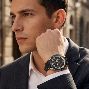 Professional man wearing Hugo Boss Santiago 1513864 with black dial and silver case leather strap water resistant 50m