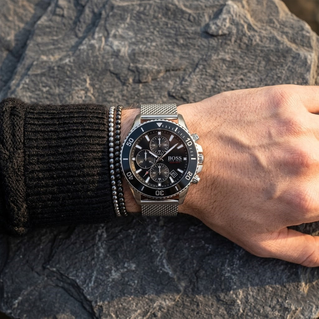 Close up of Hugo Boss Admiral 1513904 men's quartz battery watch on wrist showing black dial and luxury silver markers
