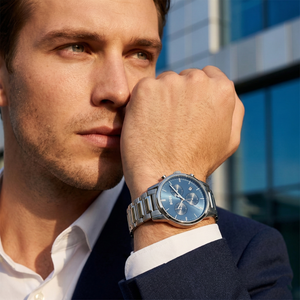 Professional man wearing Hugo Boss Dapper 1513927 with blue dial and silver metal link strap water resistant 50m