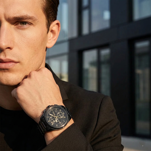 Professional man wearing Hugo Boss Volane 1513950 with black dial and black metal link strap water resistant 50m