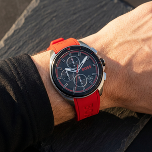 Close up of Hugo Boss Volane 1513959 on wrist showing black dial and red rubber strap with 50m water resistance