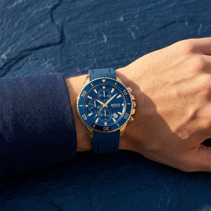 Close up of Hugo Boss Admiral 1513965 on wrist showing blue dial and blue rubber strap with 100m water resistance