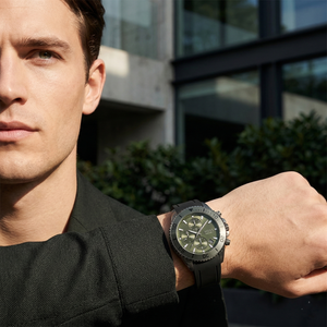 Professional leader wearing Hugo Boss Admiral 1513967 with green dial and black rubber strap water resistant 100m