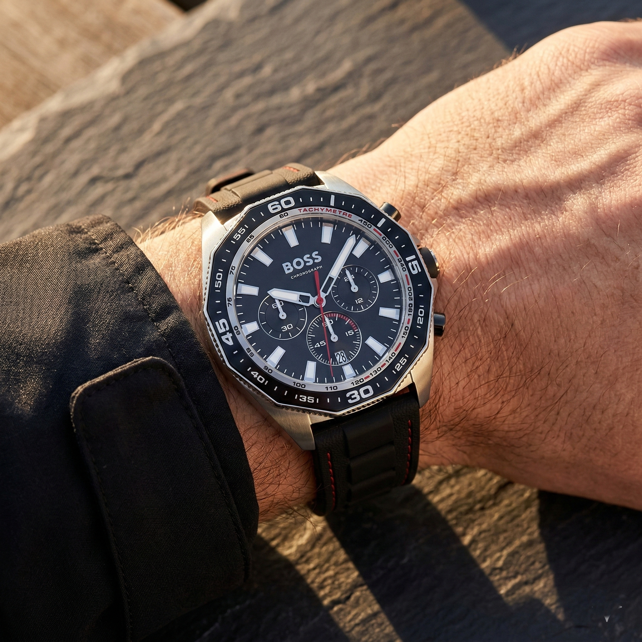 Close up of Hugo Boss Runner 1513969 on wrist showing black dial and black rubber strap with 50m water resistance