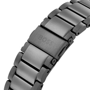 Close-up of a metallic watch strap with 'BOSS' branding on a white background