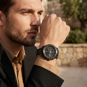 Professional man wearing Hugo Boss Centre Court 1514022 with black dial and gunmetal case rubber strap water resistant 100m