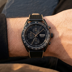 Close up of Hugo Boss Centre Court 1514022 on wrist showing black dial and black perforated rubber strap with 100m water resistance