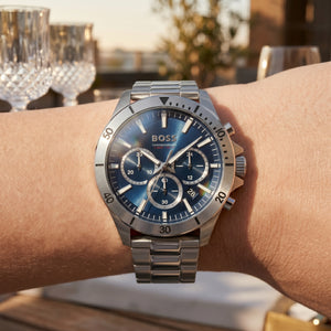 Close up shot of Boss Troper 1514069 on wrist showing the sporty silver case and detailed blue dial from Luxury Hub Store