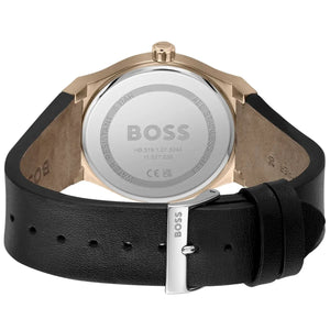 BOSS watch with black leather strap and rose gold case on a white background