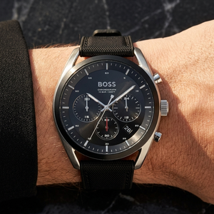 Close up of Hugo Boss Top 1514091 on wrist showing black dial and hybrid black strap with 100m water resistance
