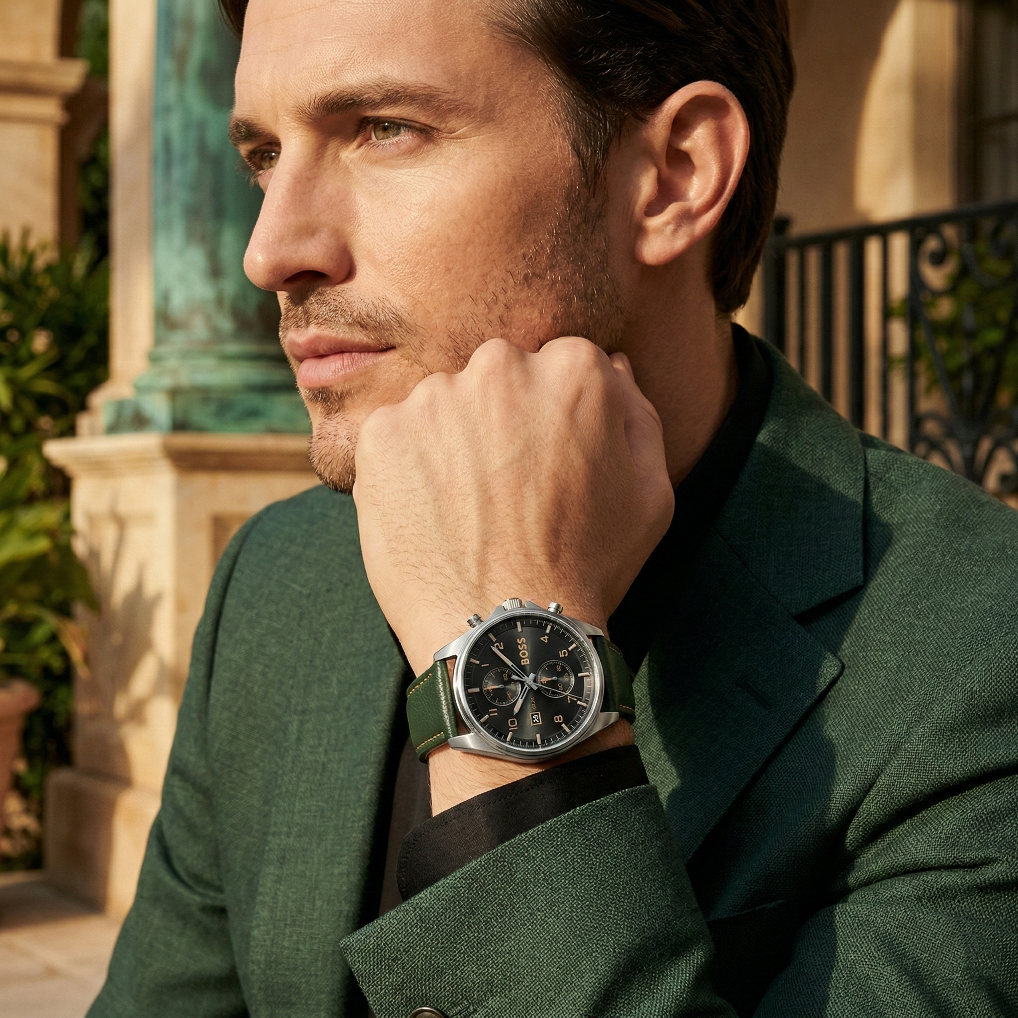 Professional man wearing Hugo Boss Sky Traveller 1514148 with black dial and green leather strap water resistant 50m