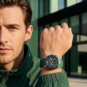 Sporty man wearing Hugo Boss Runner 1514246 with black dial and green rubber strap water resistant 50m