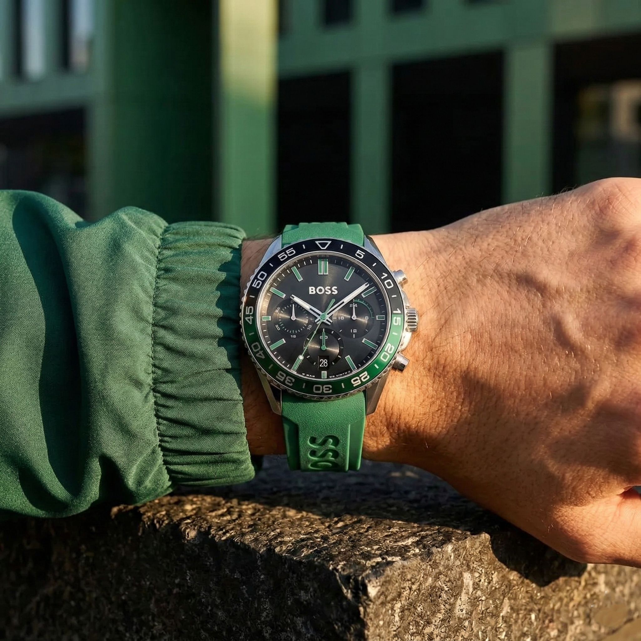 Close up of Hugo Boss Runner 1514246 on wrist showing black dial and green rubber strap with 50m water resistance