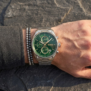 Close up shot of Hugo Boss 1514265 on wrist showing green dial and gold-tone sub-dial rings
