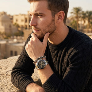 Elegant man wearing Hugo Boss Hero 1514269 men's quartz battery watch with two-tone case and luxury racing black dial