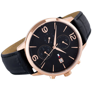 Left angled view of Tommy Hilfiger Liam 1710358 men's quartz battery watch showing black leather strap and gold-tone case profile