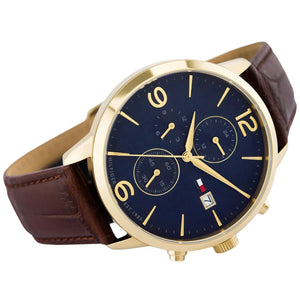 Right angled view of Tommy Hilfiger Liam 1710359 men's quartz battery watch highlighting gold finish and blue dial accents