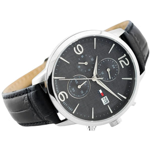 Left angled view of Tommy Hilfiger Liam 1710361 men's quartz battery watch showing black leather strap and silver-tone case profile