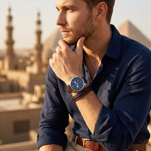 Elegant dynamic man wearing Tommy Hilfiger Evan Chronograph 1710393 sports watch with integrated flexible rich brown leather strap adding distinctive bold dynamic masculine casually luxurious style visual flow central Analogue central central Analogue Central central central Analogue Central