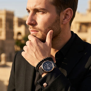 Lifestyle photo of Tommy Hilfiger 1710505 showing the watch on a man's wrist with black mesh strap