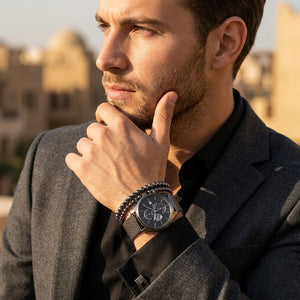 Man wearing a watch with a blurred background