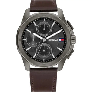 Tommy Hilfiger Walker 1710623 men's watch featuring a gunmetal grey stainless steel case, textured dark grey multi-function dial, and brown leather strap