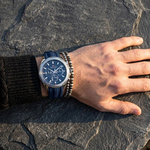 Close up of Tommy Hilfiger Lars 1710649 men's quartz battery watch on wrist showing blue waffle dial and silver-tone markers