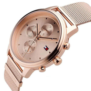 Left angled view of Tommy Hilfiger 1781907 women's quartz battery watch showing rose gold mesh bracelet and slim case profile
