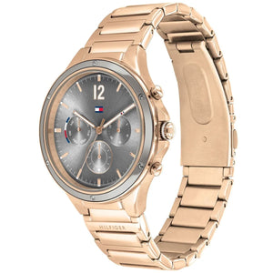 Angled real-life photo of Tommy Hilfiger 1782277 showing the polished gold case and grey dial