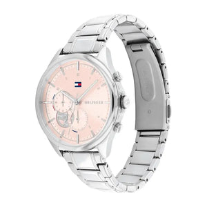 Angled real-life photo of Tommy Hilfiger 1782414 showing the polished silver case and pink sunray dial