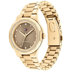 Angled real-life photo of Tommy Hilfiger 1782725 showing the polished gold case and crystal detail