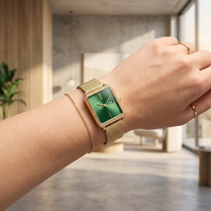 Close up of Tommy Hilfiger Tea 1782791 women's quartz battery watch on wrist showing square sage green dial and luxury crystal bezel