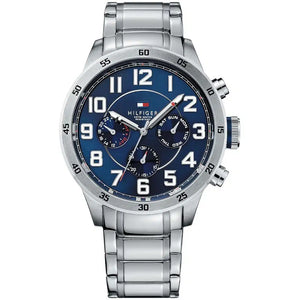Tommy Hilfiger Deckard 1791053 men's watch featuring a silver stainless steel case, navy blue dial with bold Arabic numerals, and link bracelet