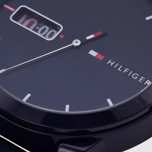 Close-up of a Tommy Hilfiger watch face with digital display.