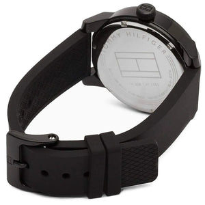 Caseback of Tommy Hilfiger Denim 1791382 men's quartz battery watch showing technical specs black dial and rubber strap